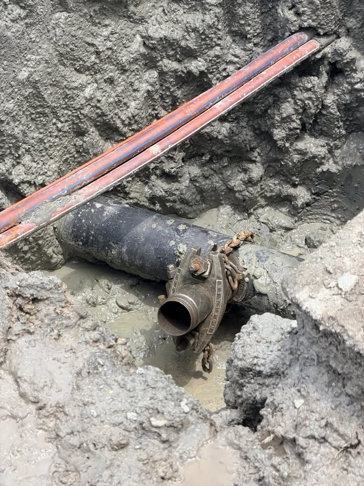 Close-up of an underground utility line safely exposed using hydro excavation daylighting, with no damage to surrounding cables